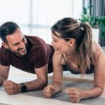 two people doing plank at home