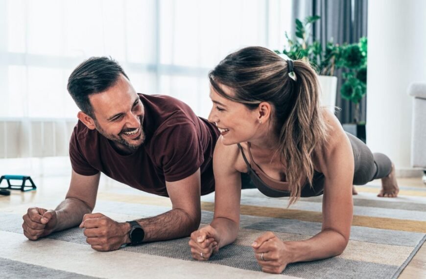 two people doing plank at home