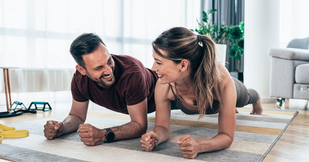 two people doing plank at home